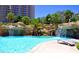 Relaxing pool area with waterfalls and lounge chairs at 222 Karen Ave # 2708, Las Vegas, NV 89109