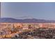 Stunning aerial view of city lights and mountain range at dusk at 222 Karen Ave # 3601, Las Vegas, NV 89109