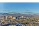 Daytime aerial view showcasing Las Vegas's expansive cityscape, mountains, and residential areas at 222 Karen Ave # 3601, Las Vegas, NV 89109