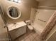 Clean bathroom with white vanity, bathtub, and grab bars at 2235 High Dunes Ln, Laughlin, NV 89029