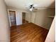 Bedroom with mirrored closet doors and wood flooring at 2235 High Dunes Ln, Laughlin, NV 89029