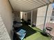 Covered patio with artificial turf and wicker furniture at 2235 High Dunes Ln, Laughlin, NV 89029