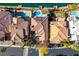 Bird's-eye view of homes with pools near lake at 2469 Sun Reef Rd, Las Vegas, NV 89128