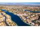 Bird's-eye view of waterfront property with surrounding homes at 2469 Sun Reef Rd, Las Vegas, NV 89128