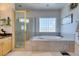 Bathroom with double vanity, soaking tub, and walk-in shower at 2469 Sun Reef Rd, Las Vegas, NV 89128