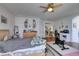 Main bedroom with wood floors, ceiling fan, and access to other rooms at 2469 Sun Reef Rd, Las Vegas, NV 89128