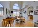 Bright dining room with hardwood floors and a large wooden table at 2469 Sun Reef Rd, Las Vegas, NV 89128