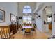 Spacious dining area featuring hardwood floors, a large table, and kitchen views at 2469 Sun Reef Rd, Las Vegas, NV 89128