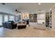 Gathering room with built-in bookcases, fireplace, and tiled floors at 2469 Sun Reef Rd, Las Vegas, NV 89128