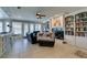 Gathering room with built-in bookcases, fireplace, and tiled floors at 2469 Sun Reef Rd, Las Vegas, NV 89128