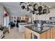 Large kitchen with an island, granite countertops and stainless steel appliances at 2469 Sun Reef Rd, Las Vegas, NV 89128