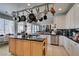 Eat-in kitchen with granite countertops and a pot rack at 2469 Sun Reef Rd, Las Vegas, NV 89128