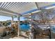 Covered patio with lake view and plenty of space for plants at 2469 Sun Reef Rd, Las Vegas, NV 89128