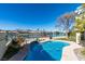 Enjoy this kidney shaped pool with a scenic lake view at 2469 Sun Reef Rd, Las Vegas, NV 89128