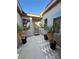 Private courtyard entry with brick pavers and potted plants at 2558 Sparrow Way, Pahrump, NV 89048