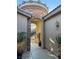 Stone arch entryway with tile flooring and potted plants at 2558 Sparrow Way, Pahrump, NV 89048