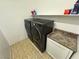 Convenient laundry room with side-by-side washer and dryer at 2558 Sparrow Way, Pahrump, NV 89048