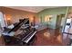 Grand piano in a spacious living room with hardwood floors at 2558 Sparrow Way, Pahrump, NV 89048