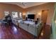 Living room with hardwood floors, sectional sofa, and home theater at 2558 Sparrow Way, Pahrump, NV 89048