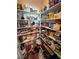 Well-stocked pantry with ample shelving for storage at 2558 Sparrow Way, Pahrump, NV 89048