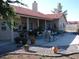 Large backyard with covered patio, seating area, and gravel landscaping at 2651 Homestead Rd, Pahrump, NV 89048