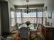 Bright dining room with bay window, chandelier, and seating for four at 2651 Homestead Rd, Pahrump, NV 89048