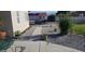 Landscaped side yard with gravel pathway and potted plants at 2651 Homestead Rd, Pahrump, NV 89048