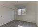 Well-lit bedroom with double closets and neutral carpeting at 2693 Hollowvale Ln, Henderson, NV 89052