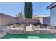 Landscaped backyard with raised garden beds and storage shed at 2693 Hollowvale Ln, Henderson, NV 89052