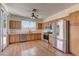 Spacious kitchen with stainless steel appliances and wood cabinets at 2693 Hollowvale Ln, Henderson, NV 89052