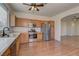 Kitchen boasts wood cabinets, stainless steel appliances, and hardwood floors at 2693 Hollowvale Ln, Henderson, NV 89052