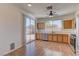 Kitchen with wood cabinets, stainless steel appliances, and hardwood floor at 2693 Hollowvale Ln, Henderson, NV 89052