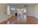 Bright living room with hardwood floors, fireplace and kitchen view at 2693 Hollowvale Ln, Henderson, NV 89052