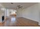 Spacious living room with hardwood floors, fireplace and ceiling fan at 2693 Hollowvale Ln, Henderson, NV 89052