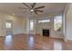 Living room featuring hardwood floors, fireplace, and view to kitchen at 2693 Hollowvale Ln, Henderson, NV 89052