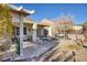 Spacious backyard patio with seating area and mature plants at 2707 White Sage Dr, Henderson, NV 89052