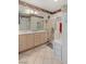 Bathroom with double sinks, a shower, and plenty of counter space at 2707 White Sage Dr, Henderson, NV 89052