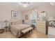 Spacious bedroom with a comfortable bed, ample light, and decorative accents at 2707 White Sage Dr, Henderson, NV 89052