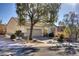 One-story home with attached garage and mature trees in front at 2707 White Sage Dr, Henderson, NV 89052