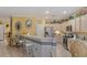 Well-equipped kitchen featuring stainless steel appliances and a breakfast bar at 2707 White Sage Dr, Henderson, NV 89052