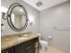 Bathroom with granite vanity, large mirror, and toilet at 30 Strada Di Villaggio # 339, Henderson, NV 89011