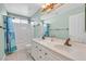 Clean bathroom with double vanity and tub shower combo at 3065 Lenoir St, Las Vegas, NV 89135