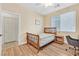 Simple bedroom with hardwood floors and ensuite access at 3065 Lenoir St, Las Vegas, NV 89135