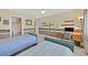 Well-lit bedroom with twin beds and a workspace at 3065 Lenoir St, Las Vegas, NV 89135