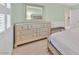 Well-lit bedroom with a large dresser and a comfortable bed at 3065 Lenoir St, Las Vegas, NV 89135