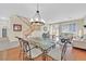 Bright dining room with hardwood floors and a glass-top table at 3065 Lenoir St, Las Vegas, NV 89135