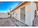 Backyard access with security gate and stone pathway at 3091 Liberty Cir, Las Vegas, NV 89121