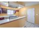 Kitchen with dark wood cabinets and white countertops at 3091 Liberty Cir, Las Vegas, NV 89121