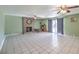 Spacious living room with brick fireplace and tile floors at 3091 Liberty Cir, Las Vegas, NV 89121