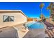 Inviting backyard pool with surrounding patio and landscaping at 3091 Liberty Cir, Las Vegas, NV 89121